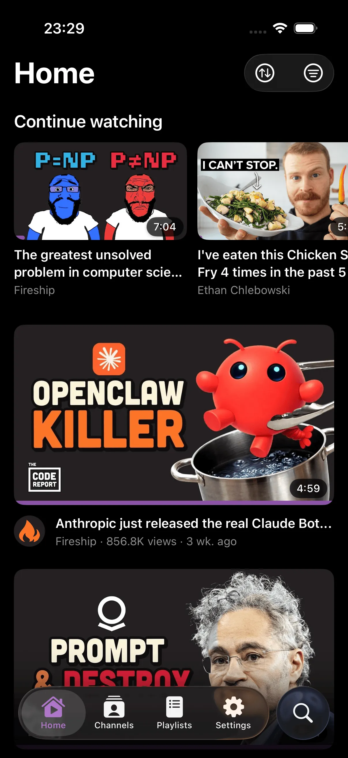 SwiftTube home screen showing video feed with channels, view counts, and watched indicators